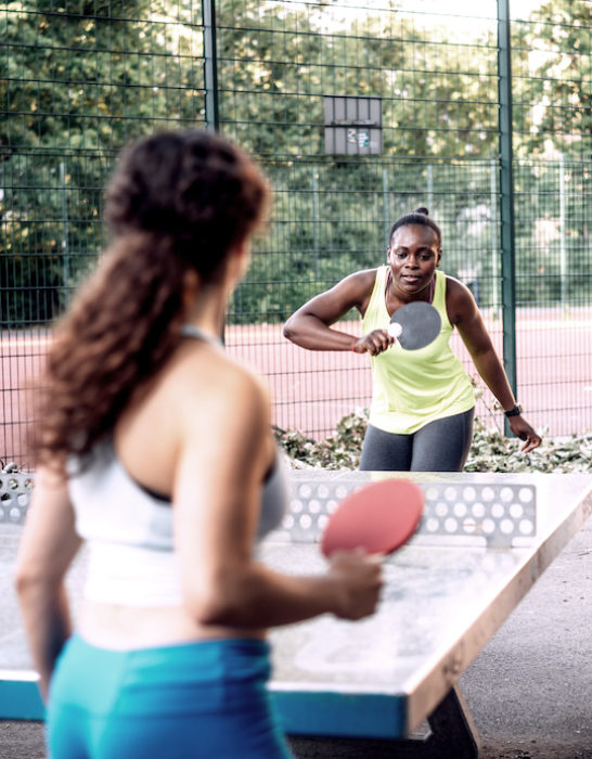 Women playing table tennis Women playing table tennis